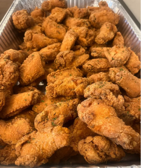 Tray of fried chicken wings prepared by In Loving Memory Catering