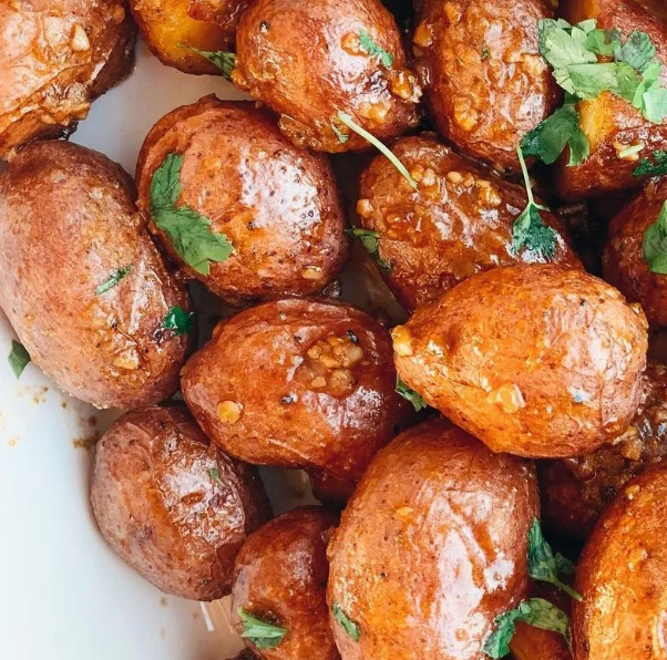 Seasoned roasted potatoes prepared by In Loving Memory Catering